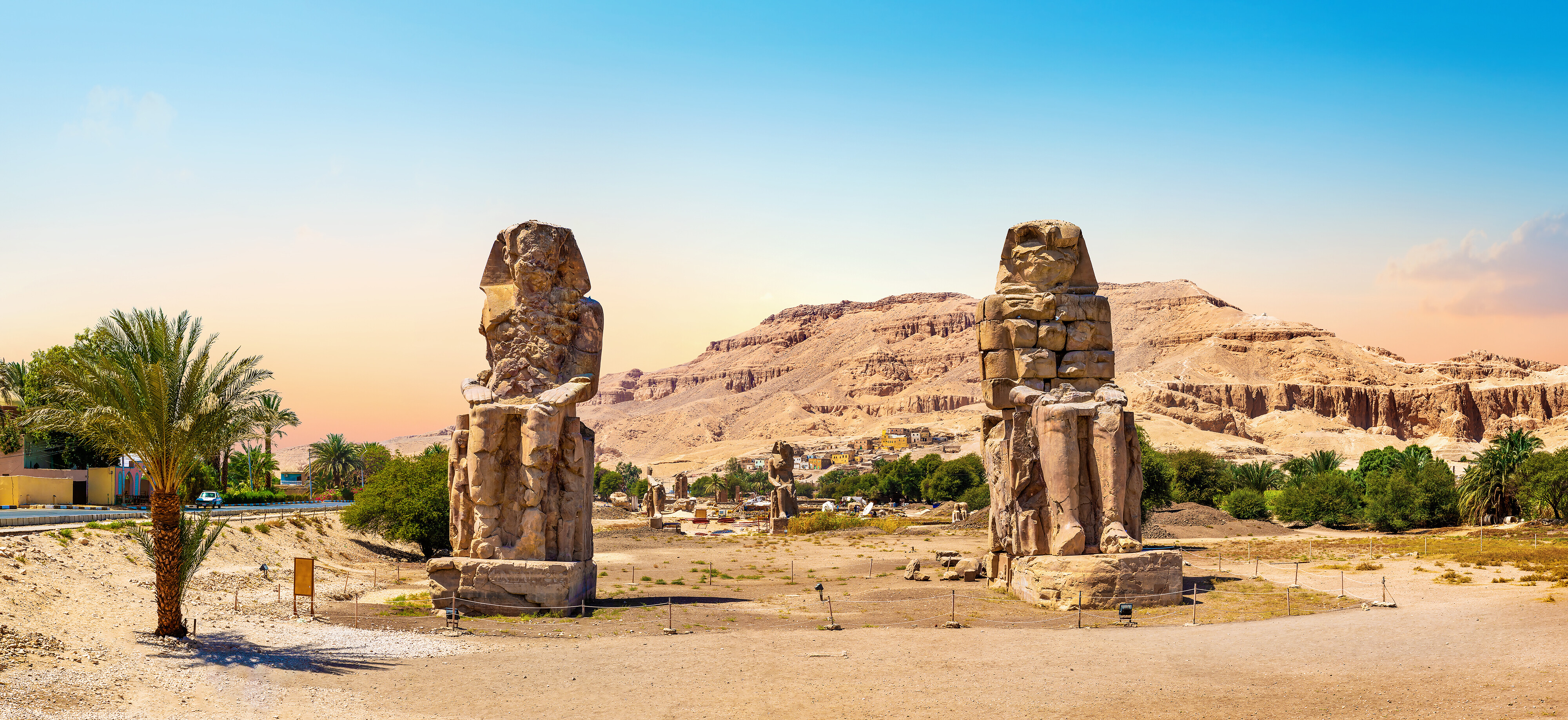 Egypt. Luxor. The Colossi of Memnon - two massive stone statues of Pharaoh Amenhotep